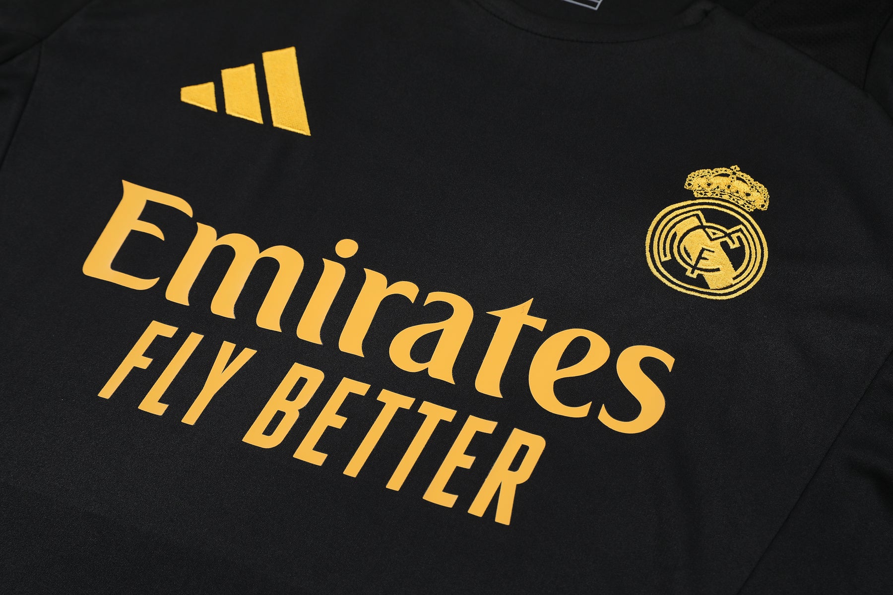 Kit Shirt + Shorts Real Madrid Black/Orange Training 24/25